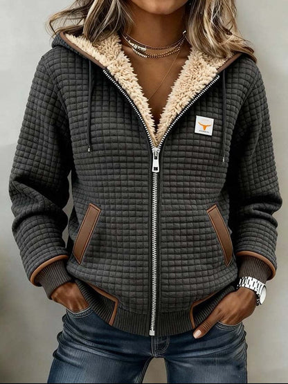 Sandra | Giacca trapuntata con cappuccio e interno sherpa da donna